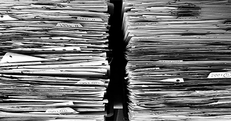 Stacks of paper: Create a new report with wholesale software instead