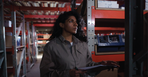 Woman working within a warehouse for warehouse optimization