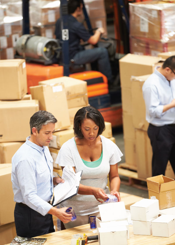 Man and women packing product for shipment